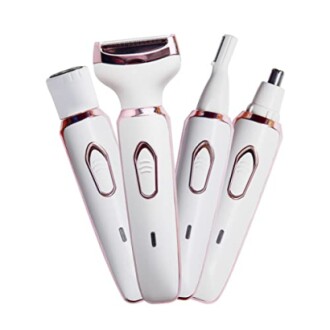 Set of four electric trimmers for personal grooming.