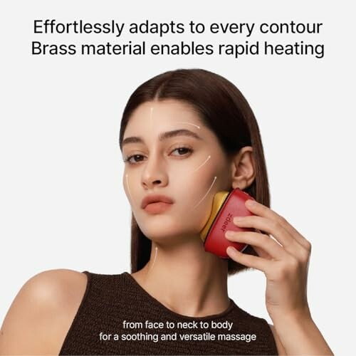 Woman using a brass facial massage tool on her face.
