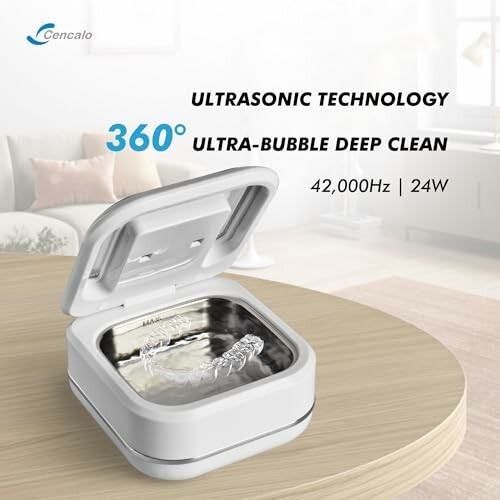 Ultrasonic cleaner device with open lid on table