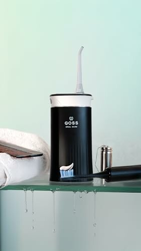 Water flosser on glass shelf with towel and comb, a perfect storage solution!